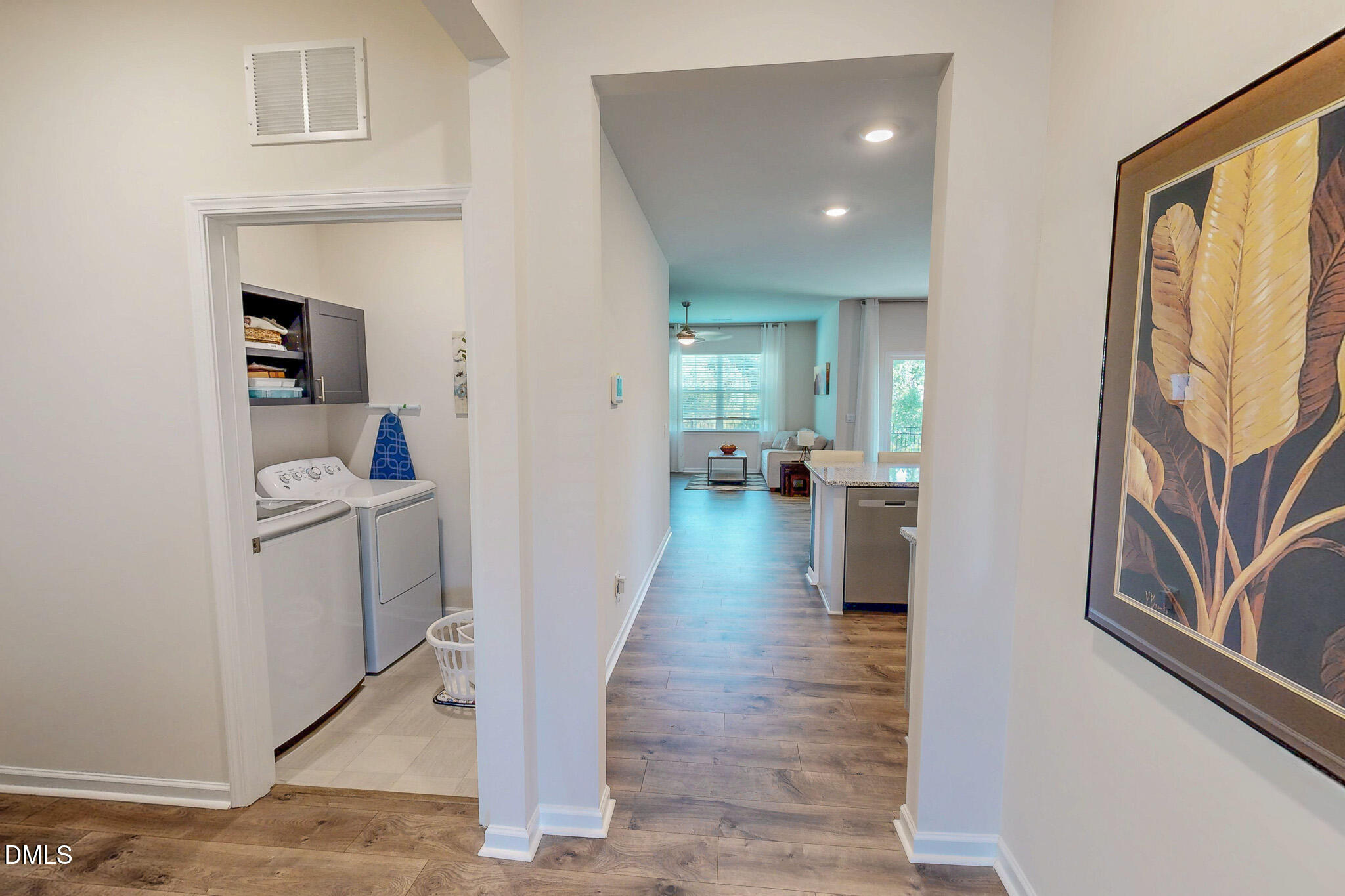 1017 Broadlands Way Graham, NC 27253 - Photo 28 of 32 a hallway with wooden floor windows and livingroom