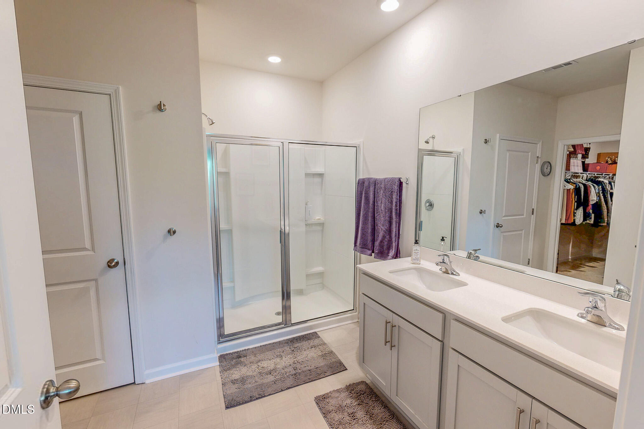 1017 Broadlands Way Graham, NC 27253 - Photo 5 of 32 a spacious bathroom with a double vanity sink a shower and a mirror