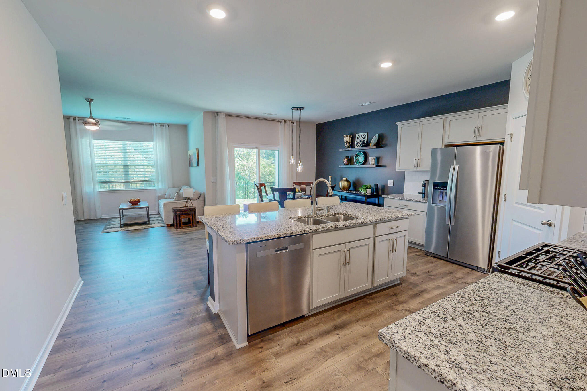 1017 Broadlands Way Graham, NC 27253 - Photo 9 of 32 a kitchen with stainless steel appliances granite countertop a stove a sink a refrigerator and a refrigerator