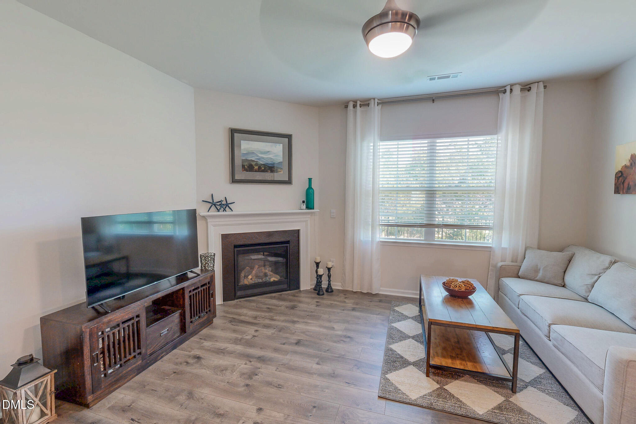1017 Broadlands Way Graham, NC 27253 - Photo 10 of 32 a living room with furniture and a flat screen tv