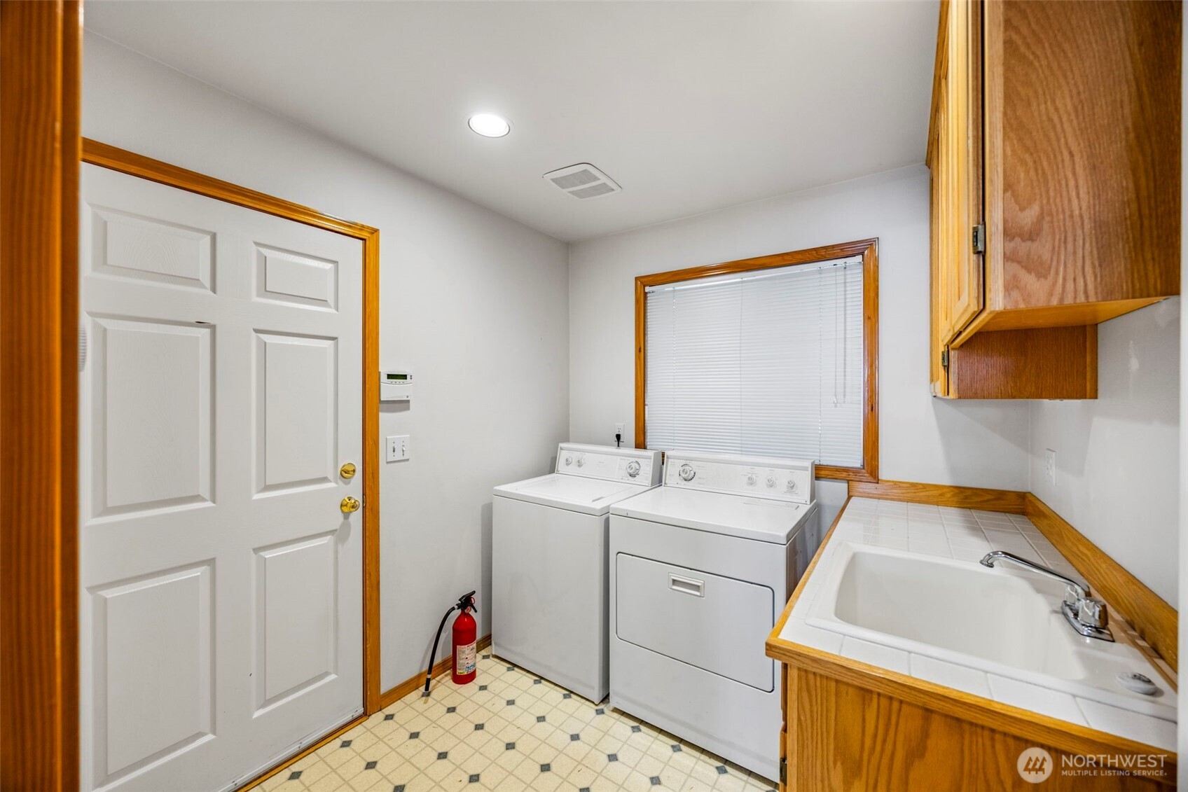 19736 Northwest Stavis Bay Road Seabeck, WA 98380 - Photo 26 of 39 a utility room with a sink dryer and washer
