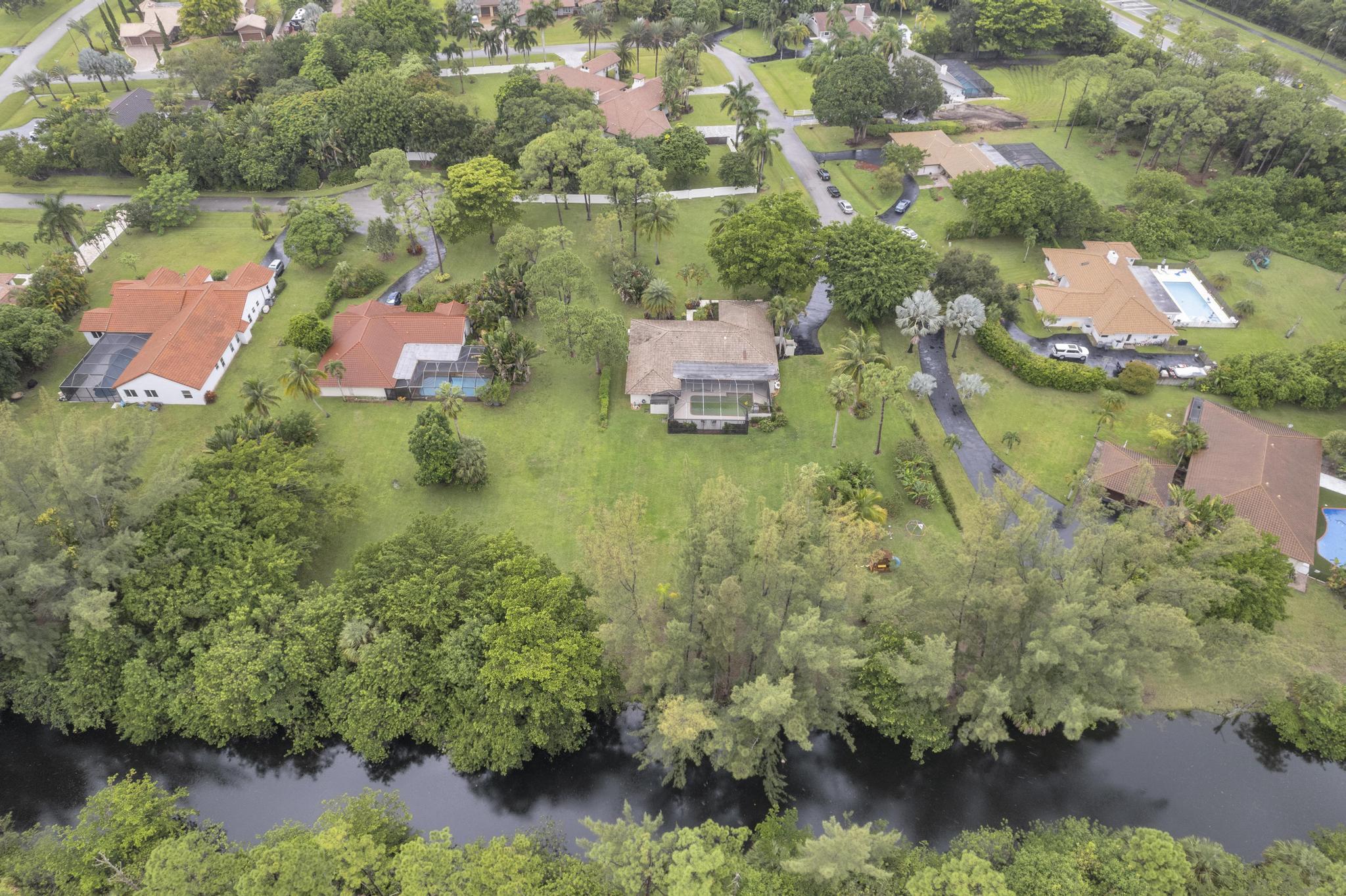 22057 Woodset Way Boca Raton, FL 33428 - Photo 48 of 51 an aerial view of residential house with outdoor space and lake view