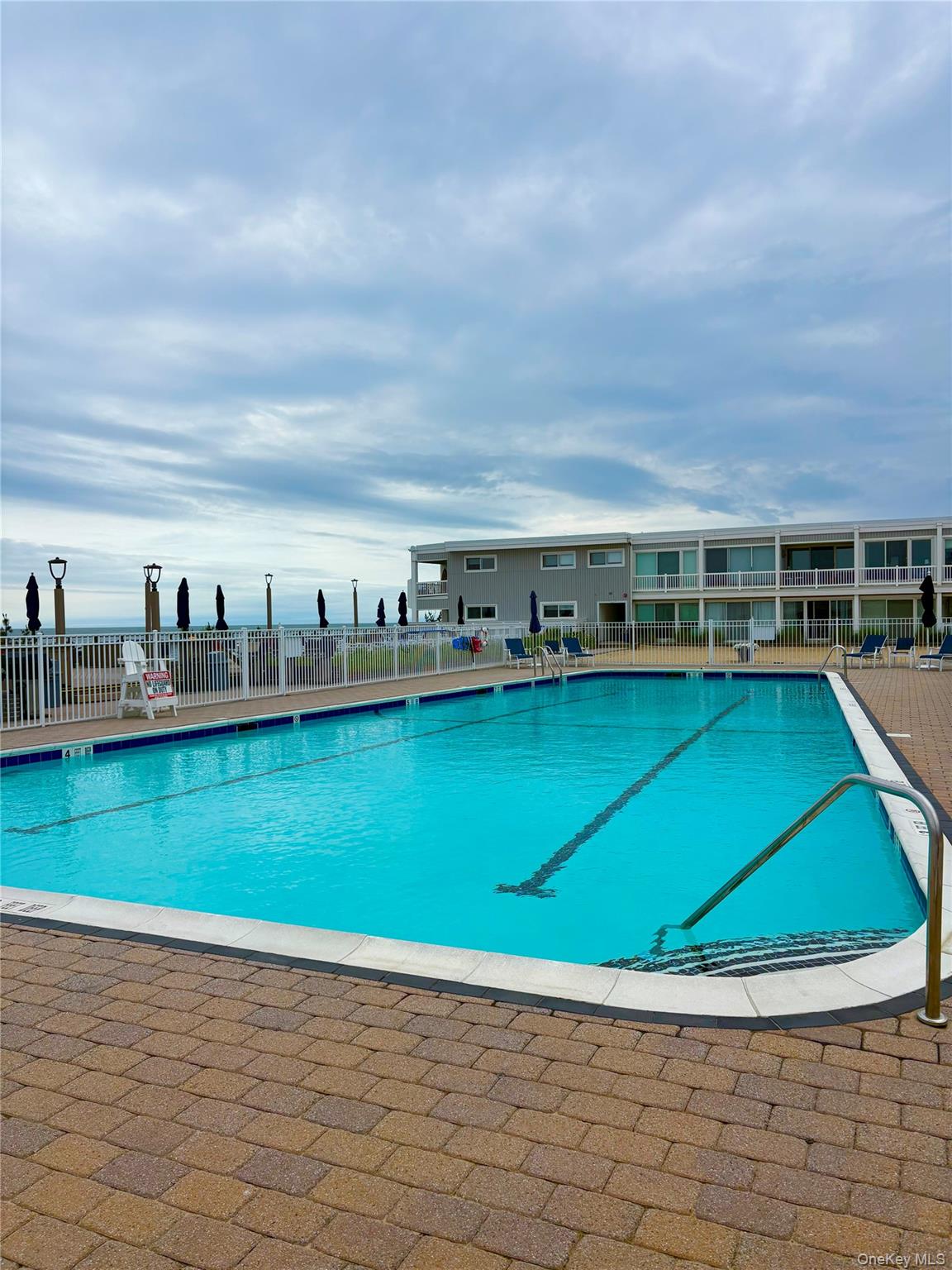 585 Dune Road, Unit A21 Westhampton Beach, NY 11978 - Photo 10 of 13 Inground pool
