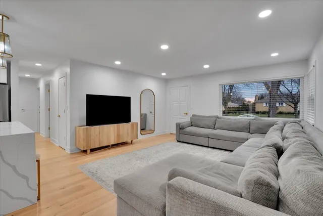 a bedroom with a bed and a night stand