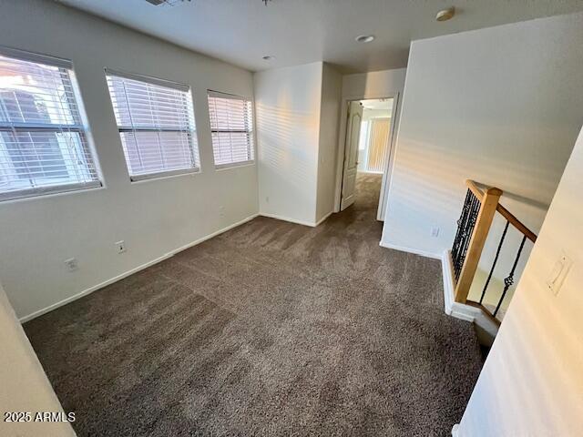 5415 East McKellips Road, Unit 31 Mesa, AZ 85215 - Photo 6 of 16 a view of an empty room with wooden floor and a window