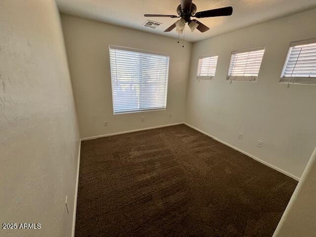 5415 East McKellips Road, Unit 31 Mesa, AZ 85215 - Photo 7 of 16 en empty room with windows and ceiling fan
