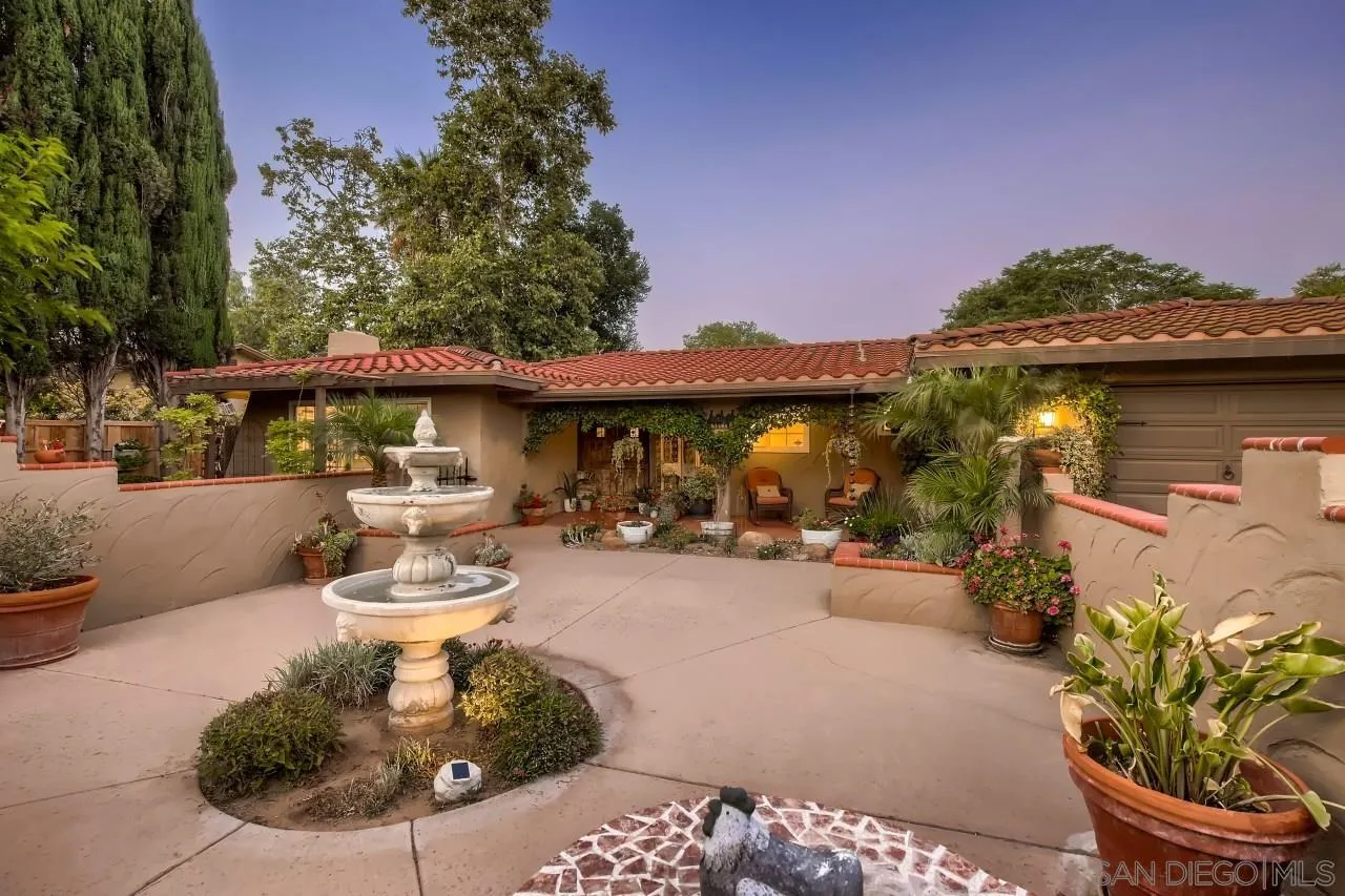 13107 Sudan Road Poway, CA 92064 - Photo 1 of 59 a view of a patio with table and chairs potted plants
