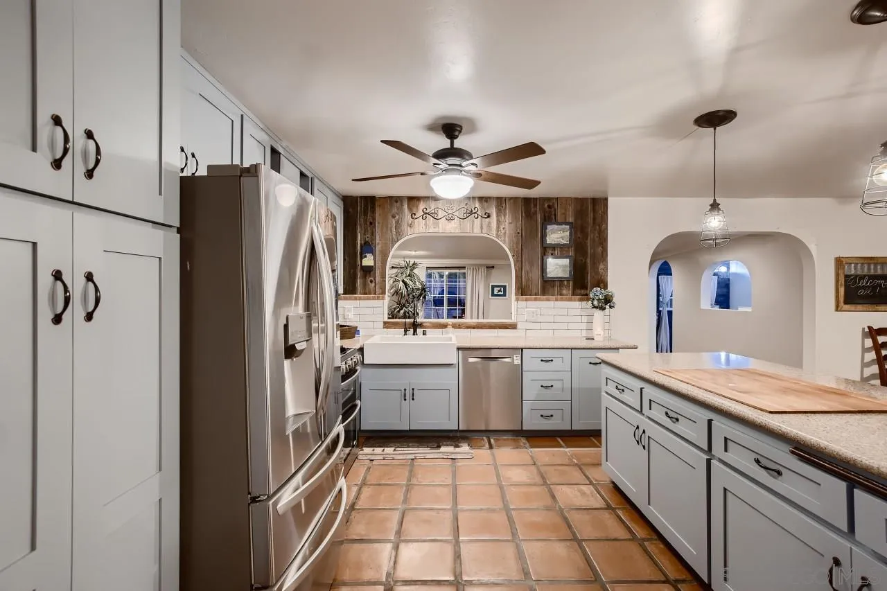 13107 Sudan Road Poway, CA 92064 - Photo 12 of 59 a kitchen with refrigerator cabinets and a sink