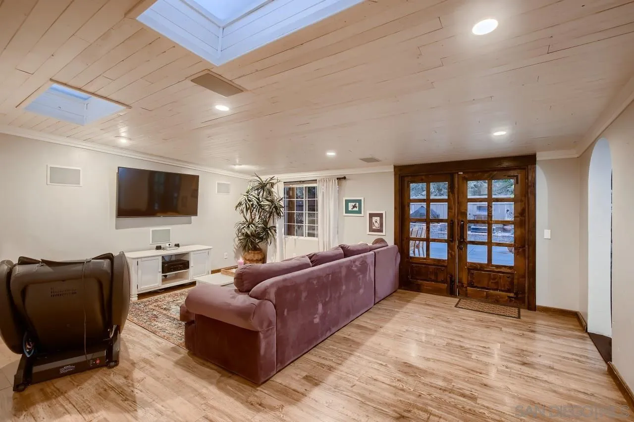 13107 Sudan Road Poway, CA 92064 - Photo 16 of 59 a living room with furniture and a flat screen tv