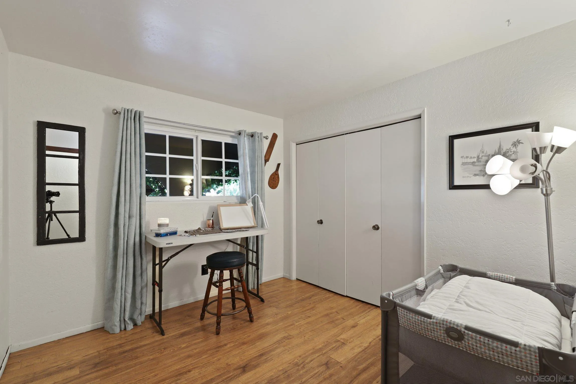 13107 Sudan Road Poway, CA 92064 - Photo 24 of 59 a workspace with furniture and wooden floor