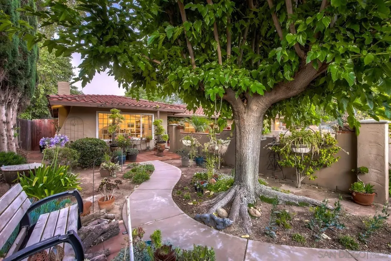 13107 Sudan Road Poway, CA 92064 - Photo 30 of 59 a view of a patio with table and chairs potted plants with large tree