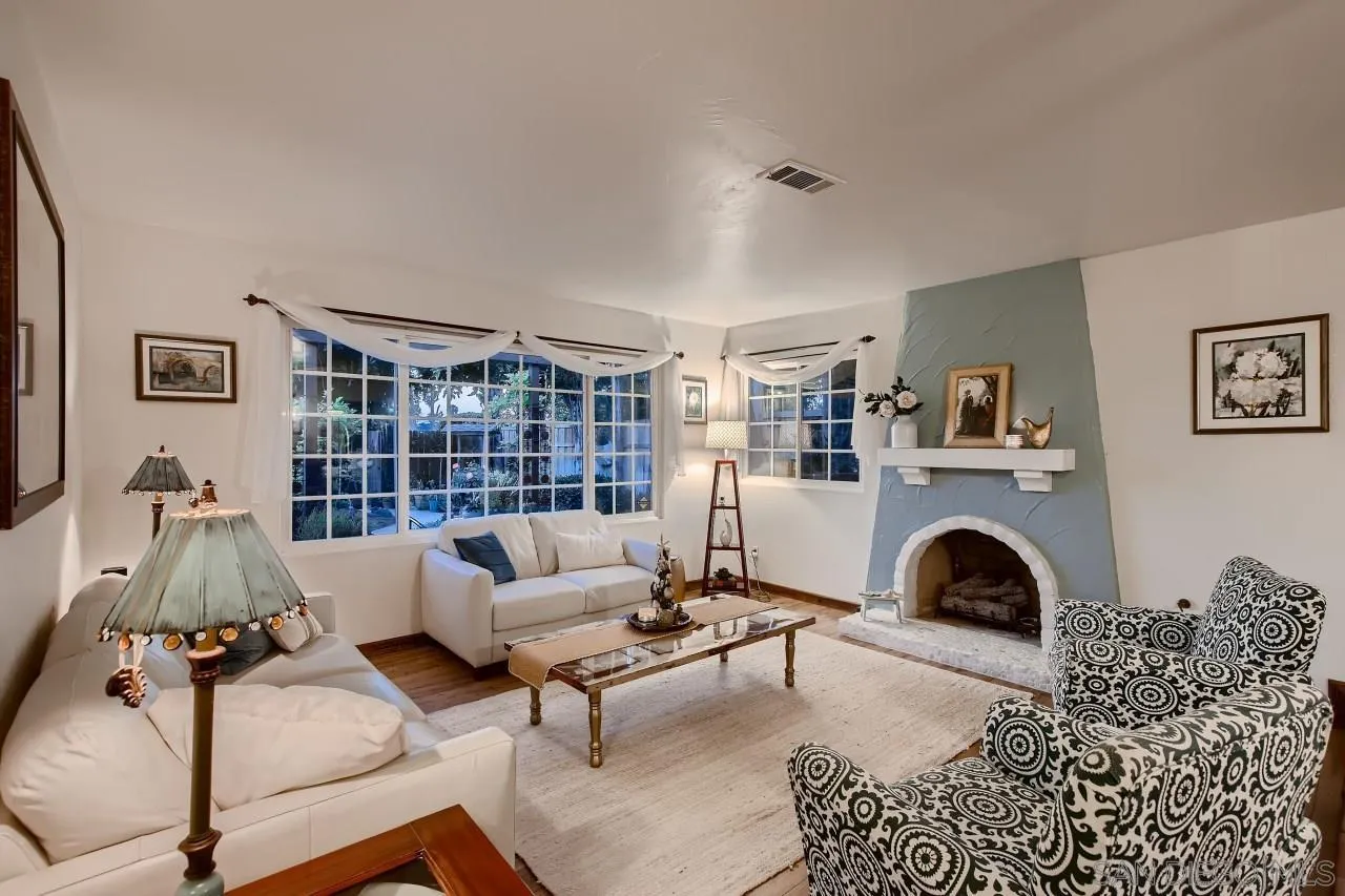 13107 Sudan Road Poway, CA 92064 - Photo 3 of 59 a living room with furniture gym equipment and a fireplace