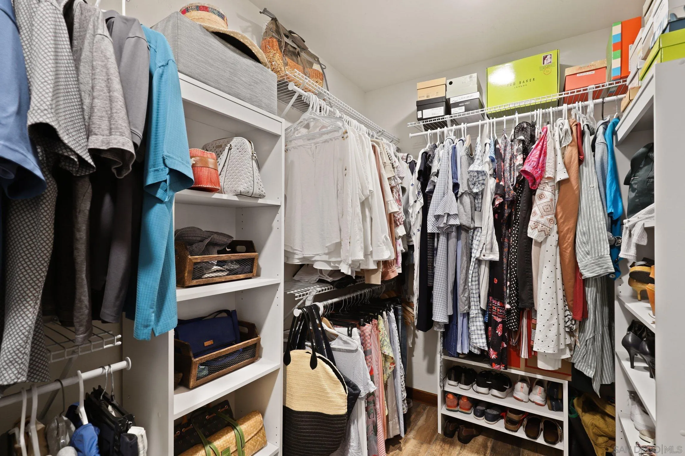 13107 Sudan Road Poway, CA 92064 - Photo 32 of 59 a view of walk in closet with clothes and shoes