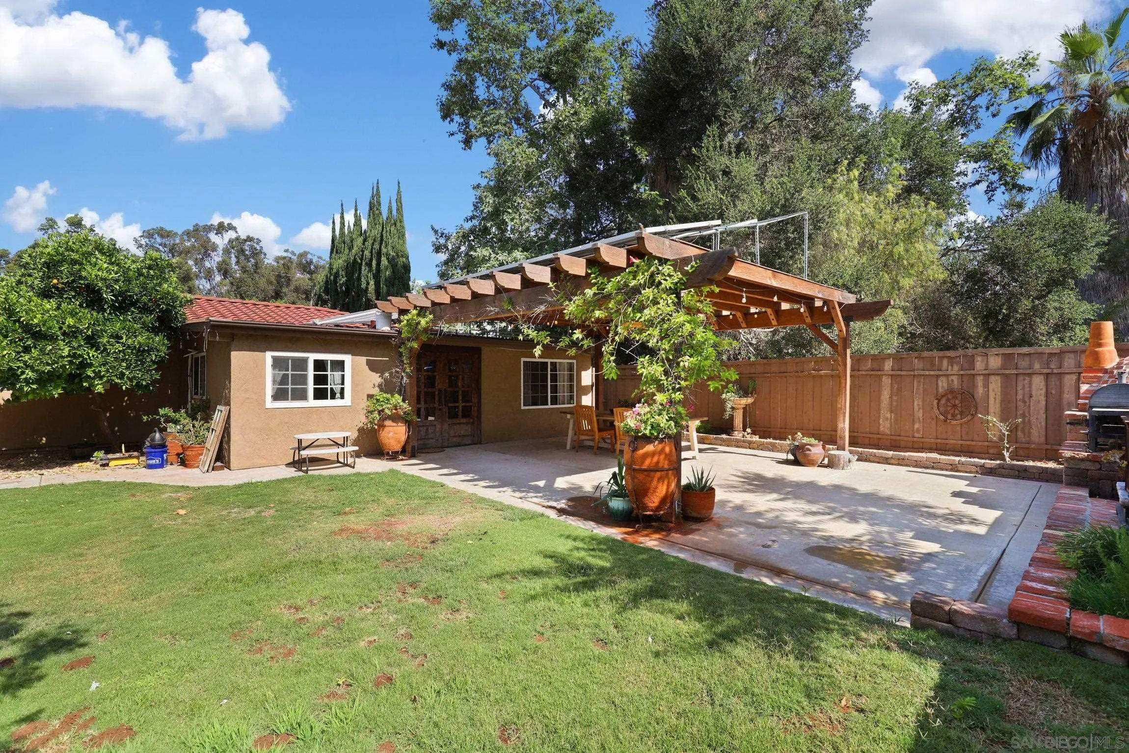 13107 Sudan Road Poway, CA 92064 - Photo 33 of 59 a view of a house with backyard and sitting area