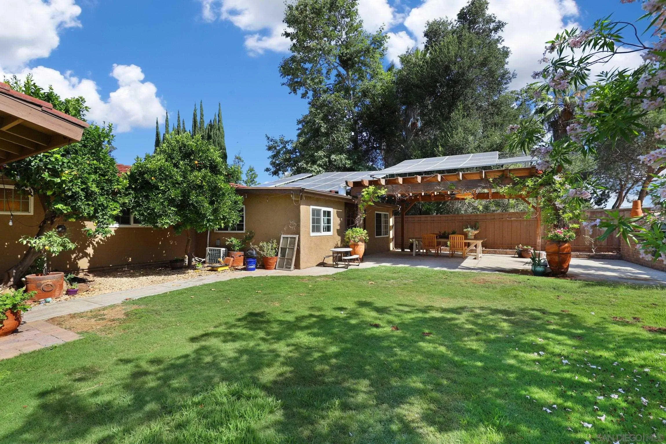 13107 Sudan Road Poway, CA 92064 - Photo 34 of 59 a view of a house with backyard and sitting area