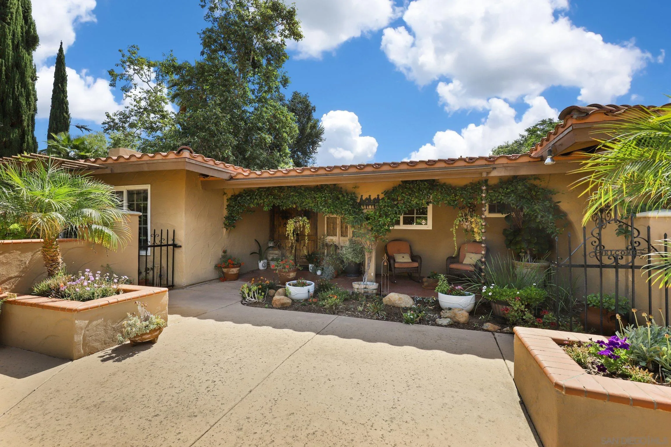 13107 Sudan Road Poway, CA 92064 - Photo 47 of 59 a view of a patio with couches chairs and potted plants