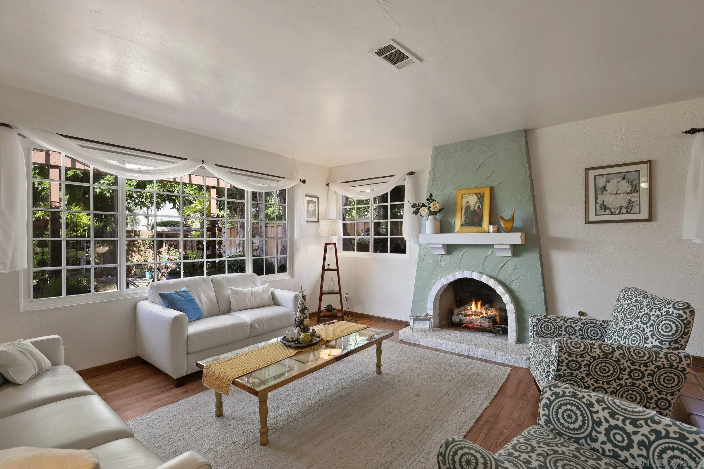 13107 Sudan Road Poway, CA 92064 - Photo 56 of 59 a living room with furniture a rug and a fireplace