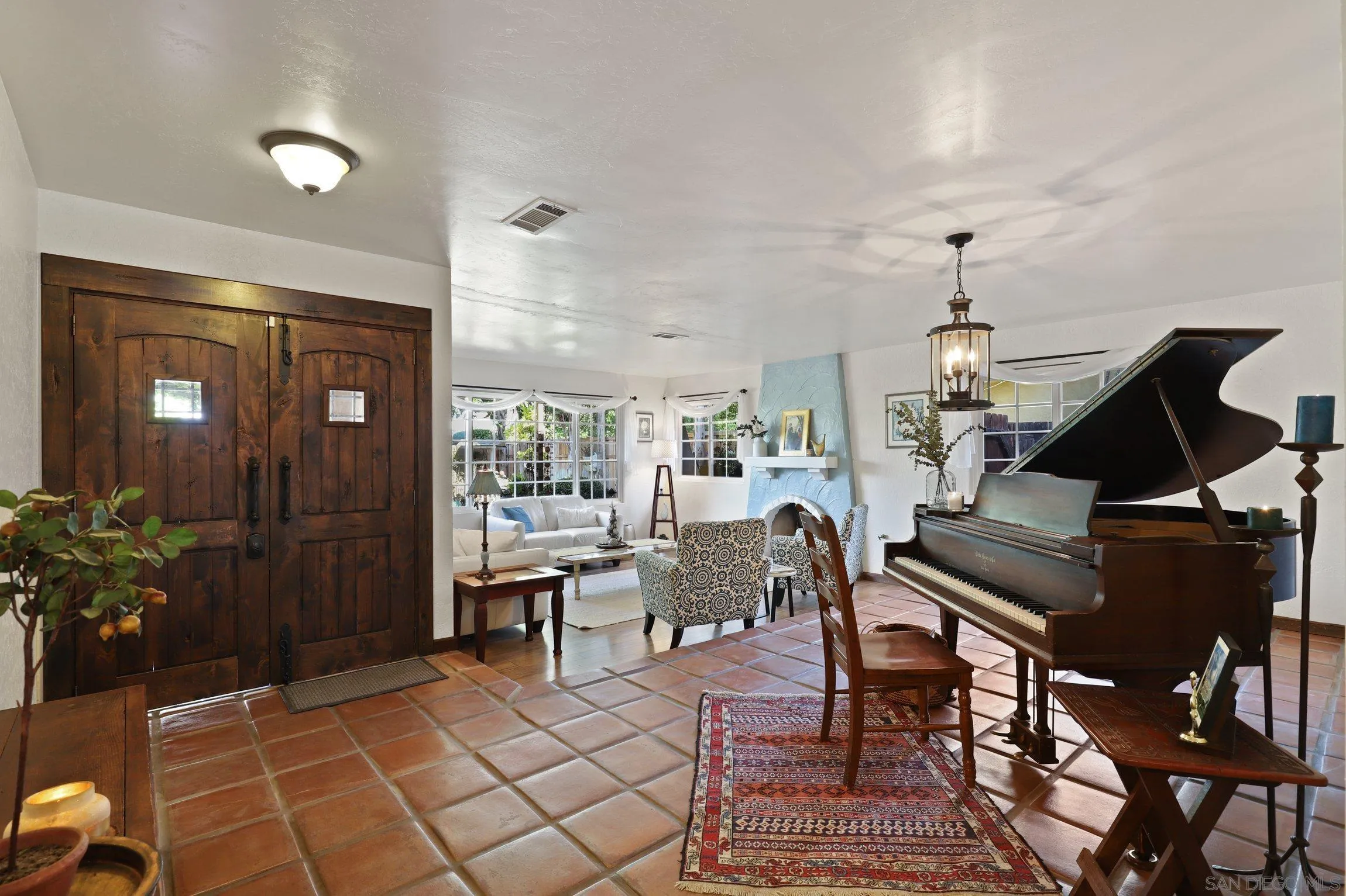 13107 Sudan Road Poway, CA 92064 - Photo 6 of 59 a living room with furniture a piano and a potted plant