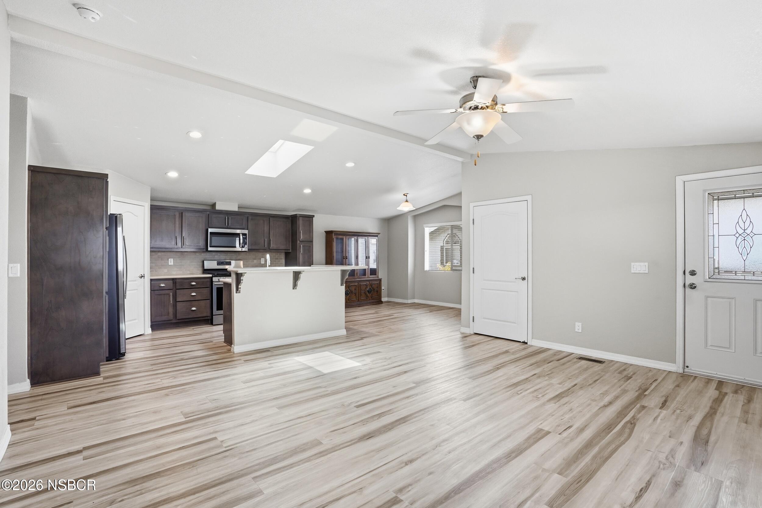 500 Atascadero Road, Unit M3 Morro Bay, CA 93442 - Photo 6 of 29 a view of kitchen with refrigerator microwave and wooden floor