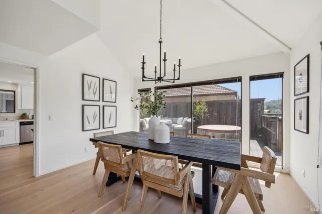 a kitchen with white cabinets stainless steel appliances and sink