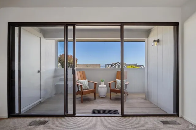 a bedroom with a bed and a lamp