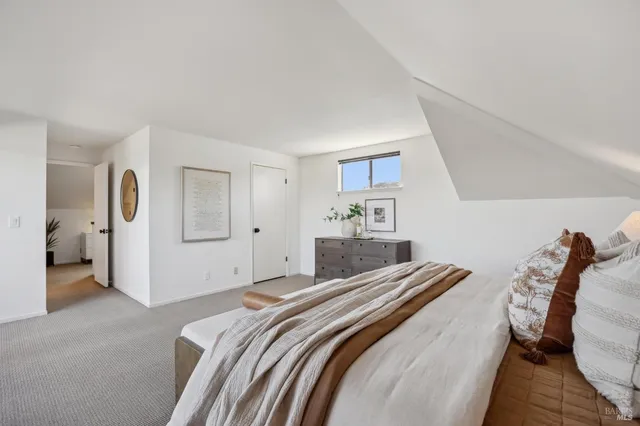 a bathroom with a double vanity sink mirror and bathtub