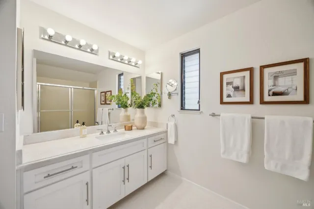 a view of a hallway with wooden floor and closet
