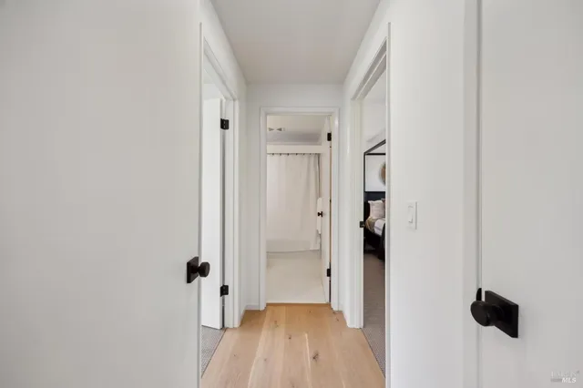 a spacious bedroom with a bed and a large window