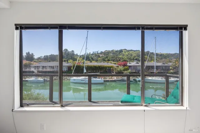 a spacious bedroom with two beds and a desk