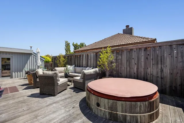 a outdoor living space with furniture and a potted plant