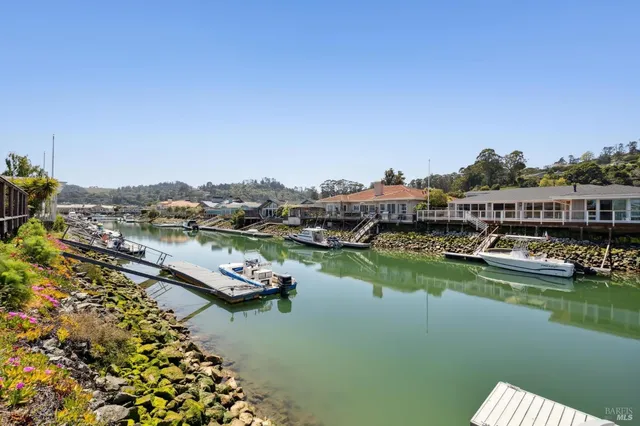 a view of a balcony with wooden floor and outdoor space