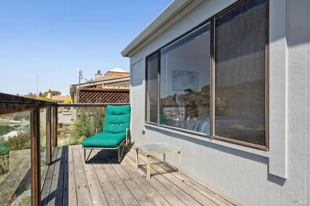 a view of balcony with furniture
