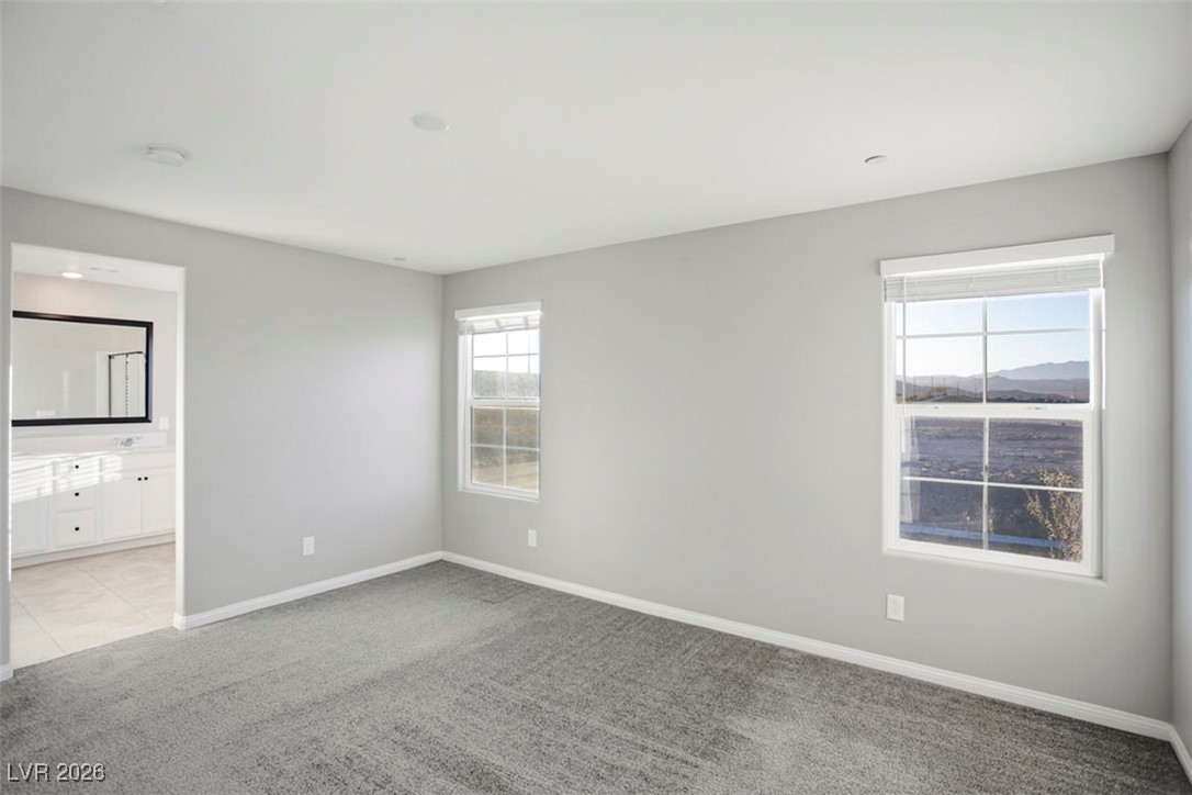 2865 Mincio Street Henderson, NV 89044 - Photo 10 of 33 Unfurnished bedroom featuring carpet floors and ensuite bath