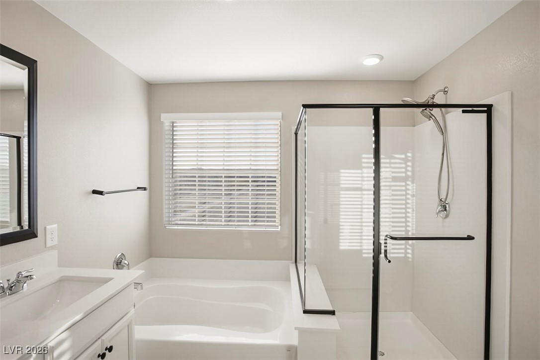 2865 Mincio Street Henderson, NV 89044 - Photo 14 of 33 Full bath with vanity, a bath, and a shower stall