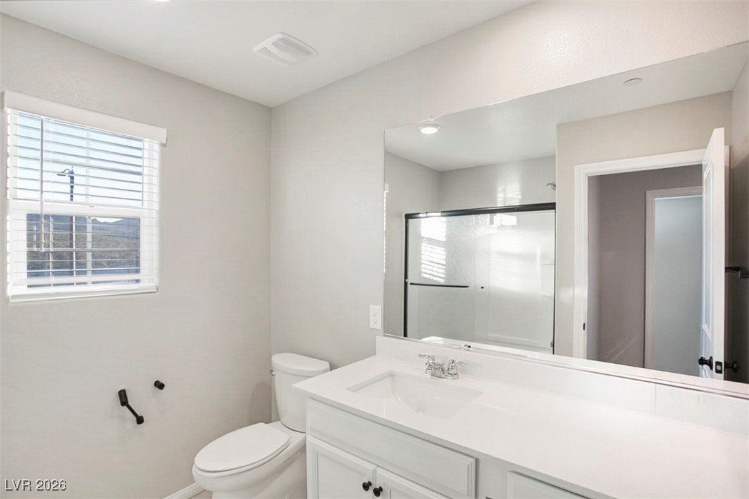 2865 Mincio Street Henderson, NV 89044 - Photo 19 of 33 Bathroom featuring vanity and a stall shower