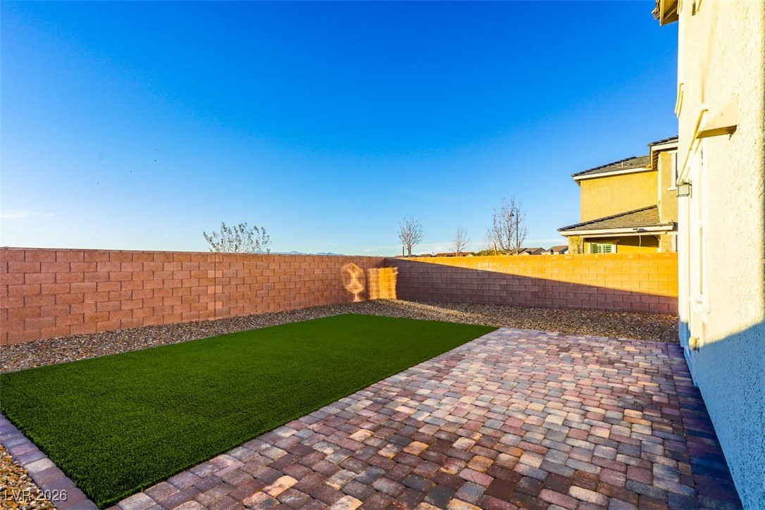 2865 Mincio Street Henderson, NV 89044 - Photo 25 of 33 Fenced backyard featuring a patio area