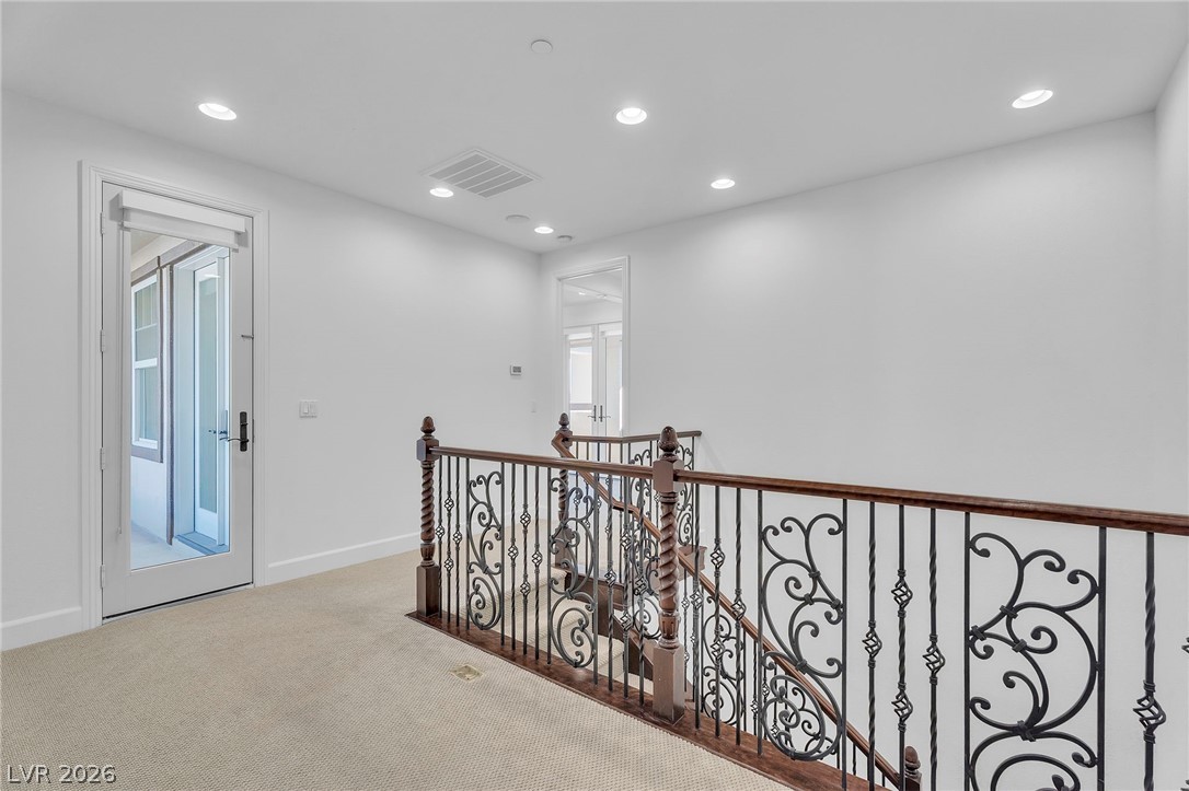 11280 Granite Ridge Drive, Unit 1037 Las Vegas, NV 89135 - Photo 24 of 51 Stairs leading to master bed and library. French door to west facing master balcony
