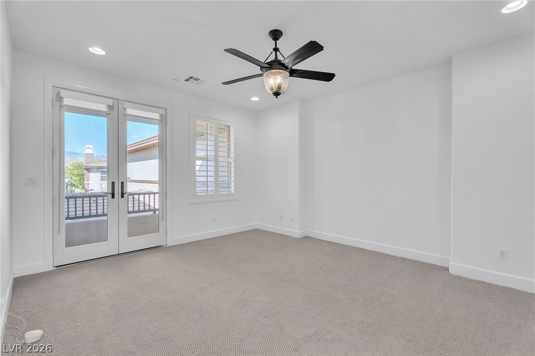 11280 Granite Ridge Drive, Unit 1037 Las Vegas, NV 89135 - Photo 25 of 51 Master bedroom with french doors, a ceiling fan, light carpet, and recessed lighting