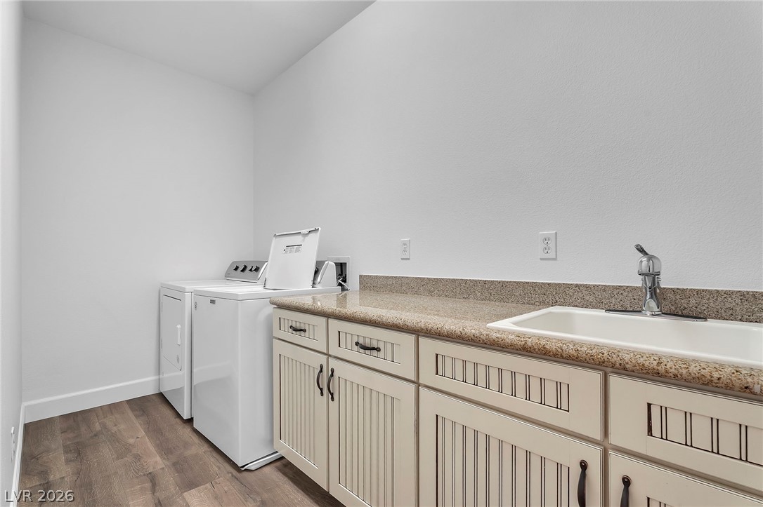 11280 Granite Ridge Drive, Unit 1037 Las Vegas, NV 89135 - Photo 32 of 51 Laundry room with ample cabinet space, full size washer and dryer, plenty of storage