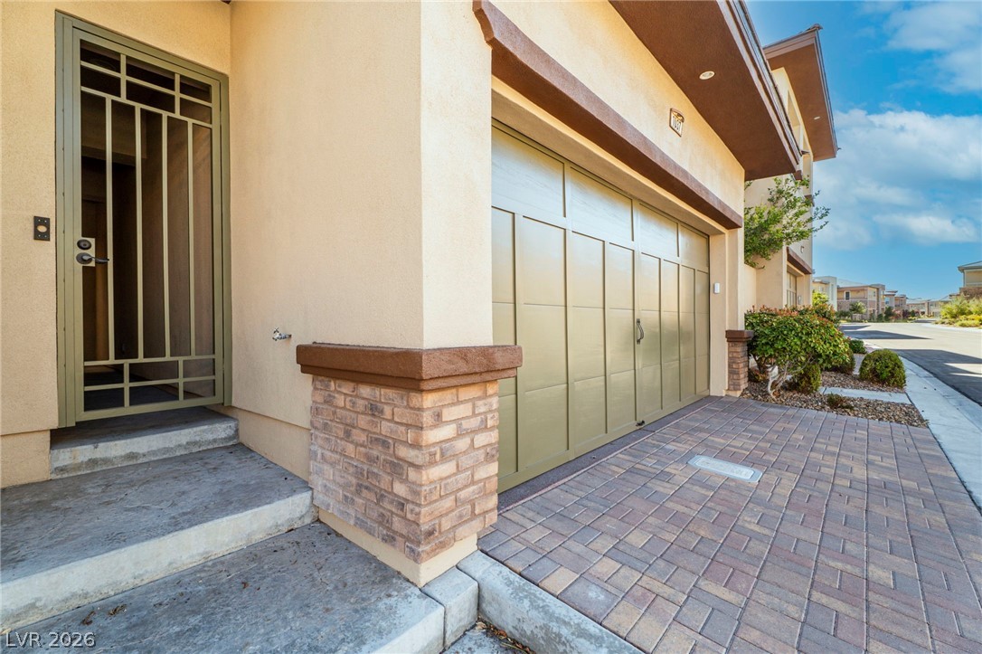 11280 Granite Ridge Drive, Unit 1037 Las Vegas, NV 89135 - Photo 4 of 51 Gate leads to the casita and the courtyard with cozy fireplace