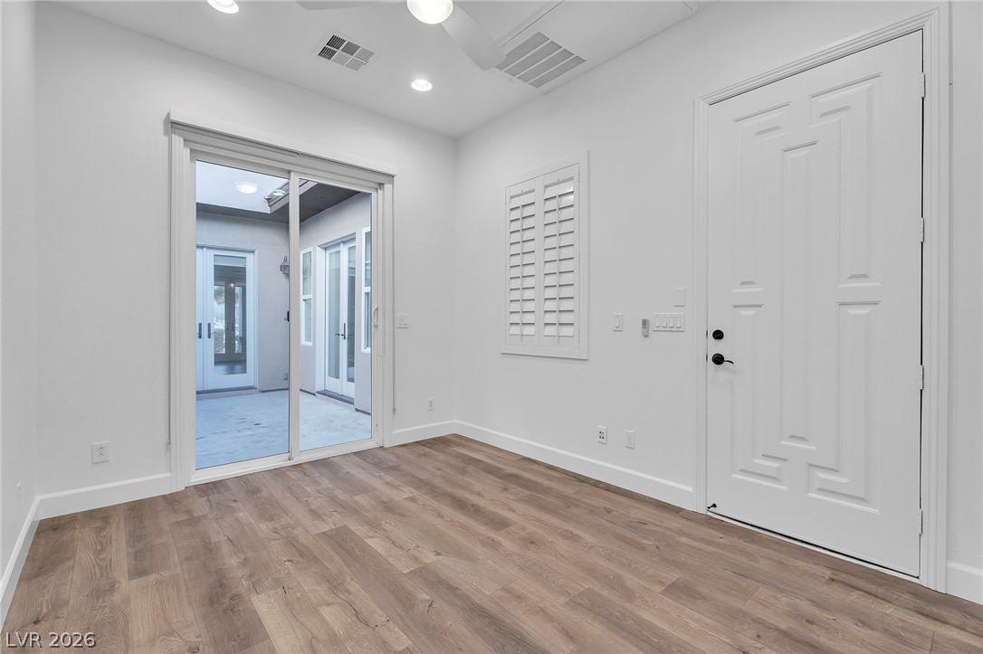 11280 Granite Ridge Drive, Unit 1037 Las Vegas, NV 89135 - Photo 41 of 51 Casita slider leads to courtyard with fireplace