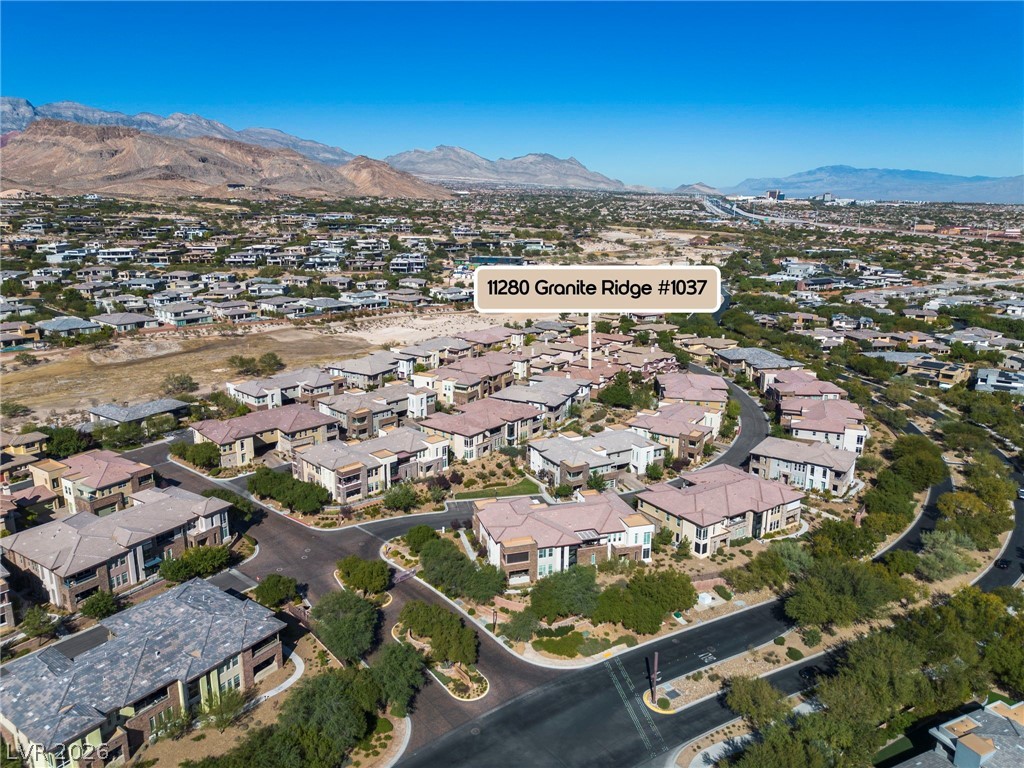 11280 Granite Ridge Drive, Unit 1037 Las Vegas, NV 89135 - Photo 9 of 51 Aerial view of Fairway Hills with the mountains in the b