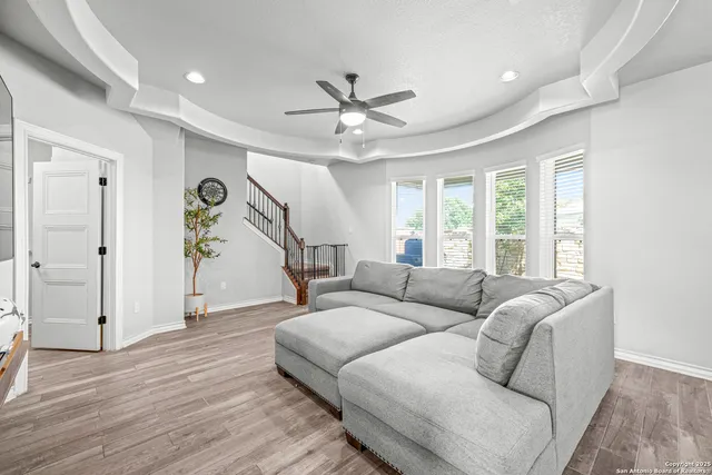 a living room with furniture and a window