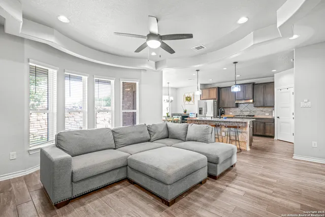 a living room with furniture and a large window