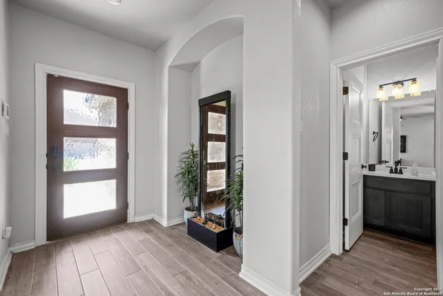 a view of a livingroom with furniture and hardwood floor