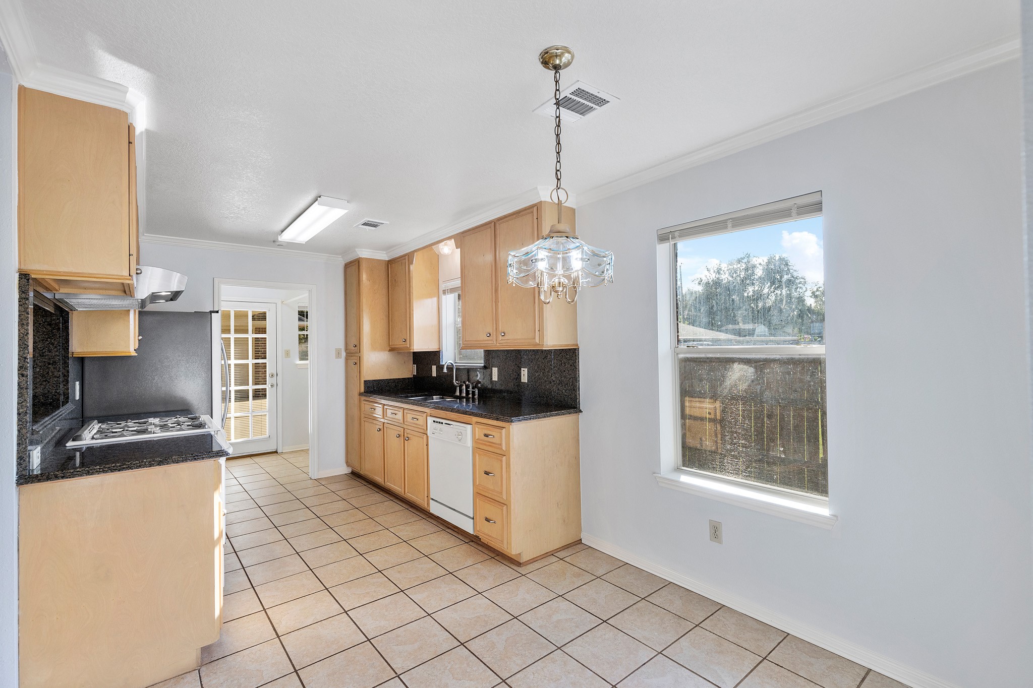 8018 Holiday Lane Houston, TX 77075 - Photo 15 of 42 a kitchen with stainless steel appliances granite countertop a stove a sink and a refrigerator
