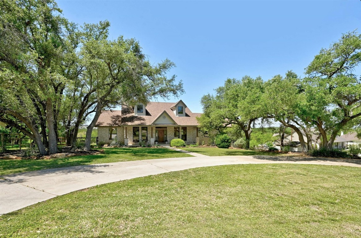 Newly remodeled, beautiful Hill Country Stone home on 1.6 acres. Perfectly situated among mature oaks and backing to a wet weather creek.