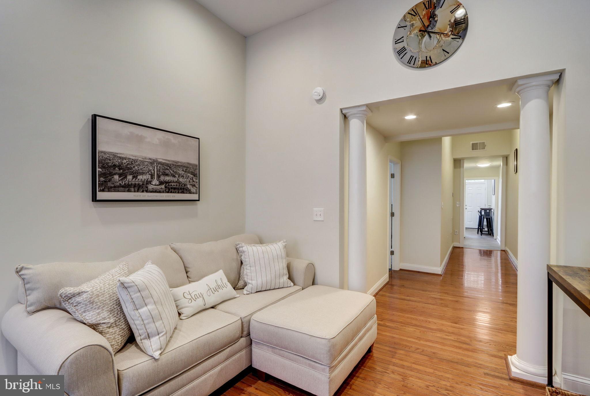 1628 North Calvert Street Baltimore, MD 21202 - Photo 11 of 50 a living room with furniture and a wooden floor