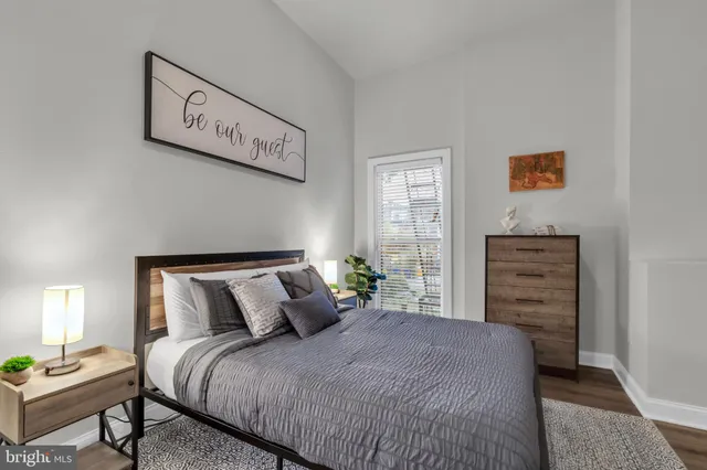 a bedroom with a bed and a couch