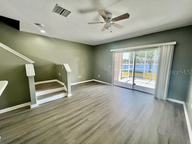 15655 Stable Run Drive Spring Hill, FL 34610 - Photo 22 of 48 wooden floor in an empty room with a window